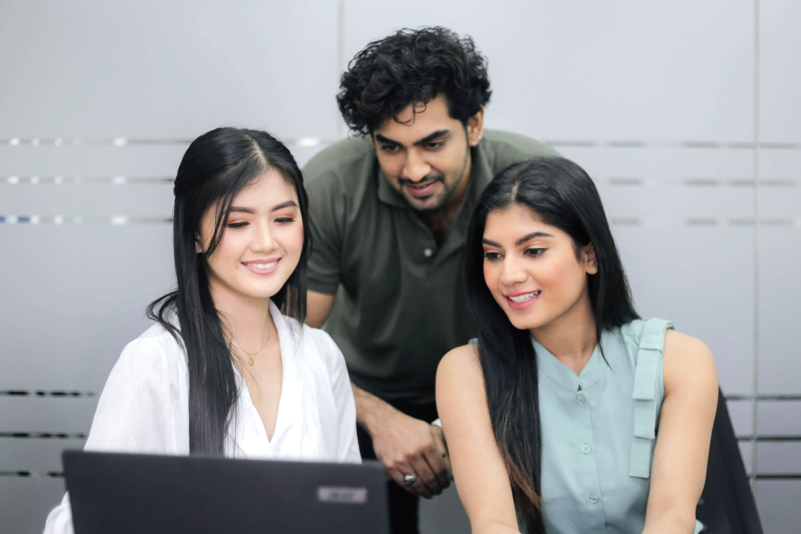 Three People Looking in the Screen