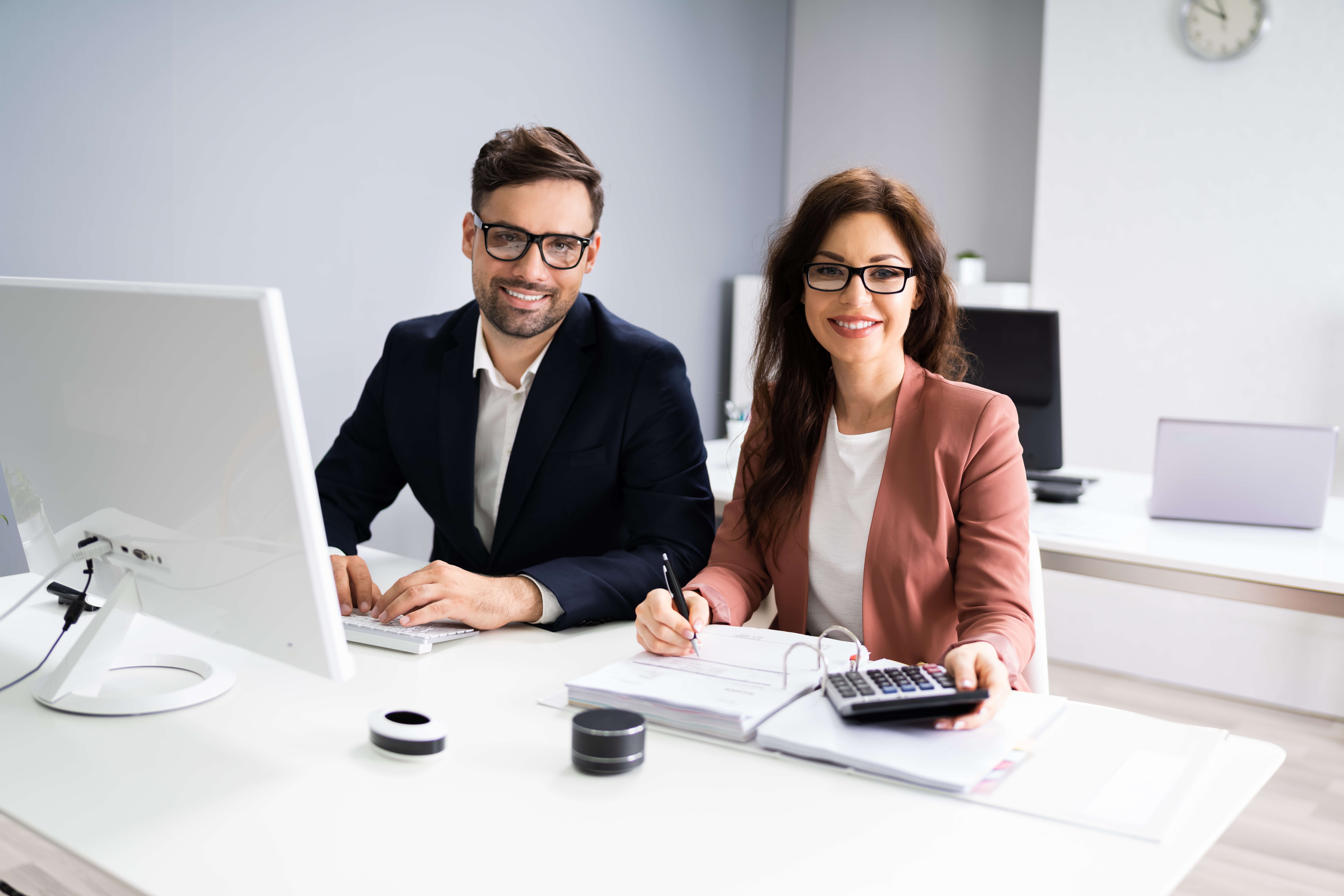 Business,Accountant,People,Doing,Tax,Audit,And,Accounting,Using,Calculator