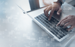 A man using his laptop for data science outsourcing tasks.