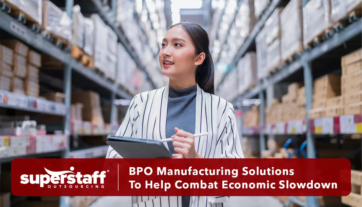 An executive checks warehouse to determine how BPO manufacturing solutions can help the business.