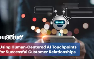An image shows a chatbot popping out of a mobile phone, representing the power of human-centered AI.