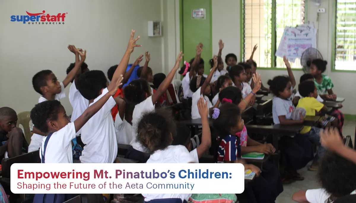 Aeta kids are inside the classroom, raising hands to answer a question.