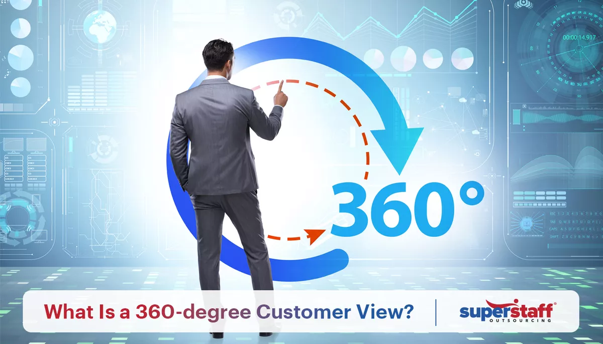 A man has his back on the camera, as he points to a 360-degree customer experience sign on the wall.
