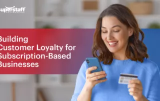 The photo shows a happy client holding a credit card in one hand and a phone in the other. The image also shows the title of the blog, "Building Customer Loyalty in 2024: The Crucial Role of Customer Service in Subscription-Based Products."