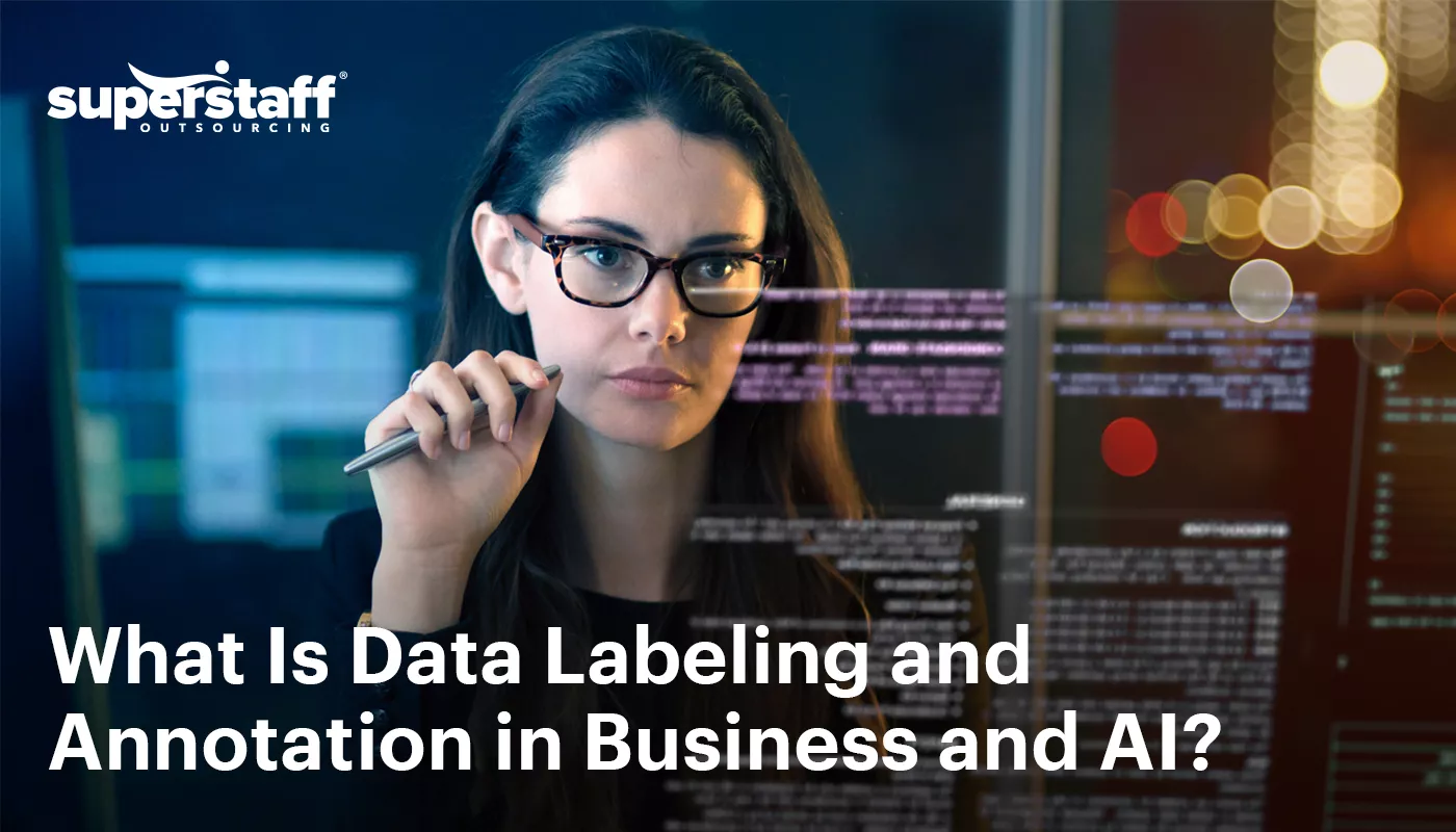 The image shows a data scientist is deep in work. It also shows the title of the blog, "What Is Data Labeling and Annotation: The Backbone of Business Analytics and AI Training."