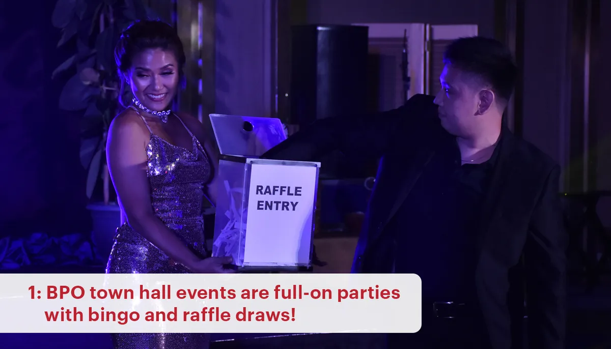 A party host holds a raffle draw box. 