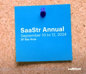 A post-it shows schedule of SaaStr Annual, a B2B sales conference.