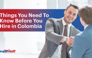 Two executives shake hands. Image caption reads: Things You Need To Know Before You Hire in Colombia.