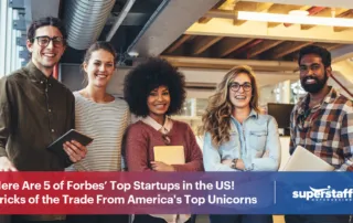 5 diverse executives smile. Image caption reads: Here Are 5 of Forbes’ Top Startups in the US! Tricks of the Trade From America's Top Unicorns