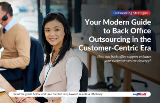 A back office outsourcing specialist smiles while working.