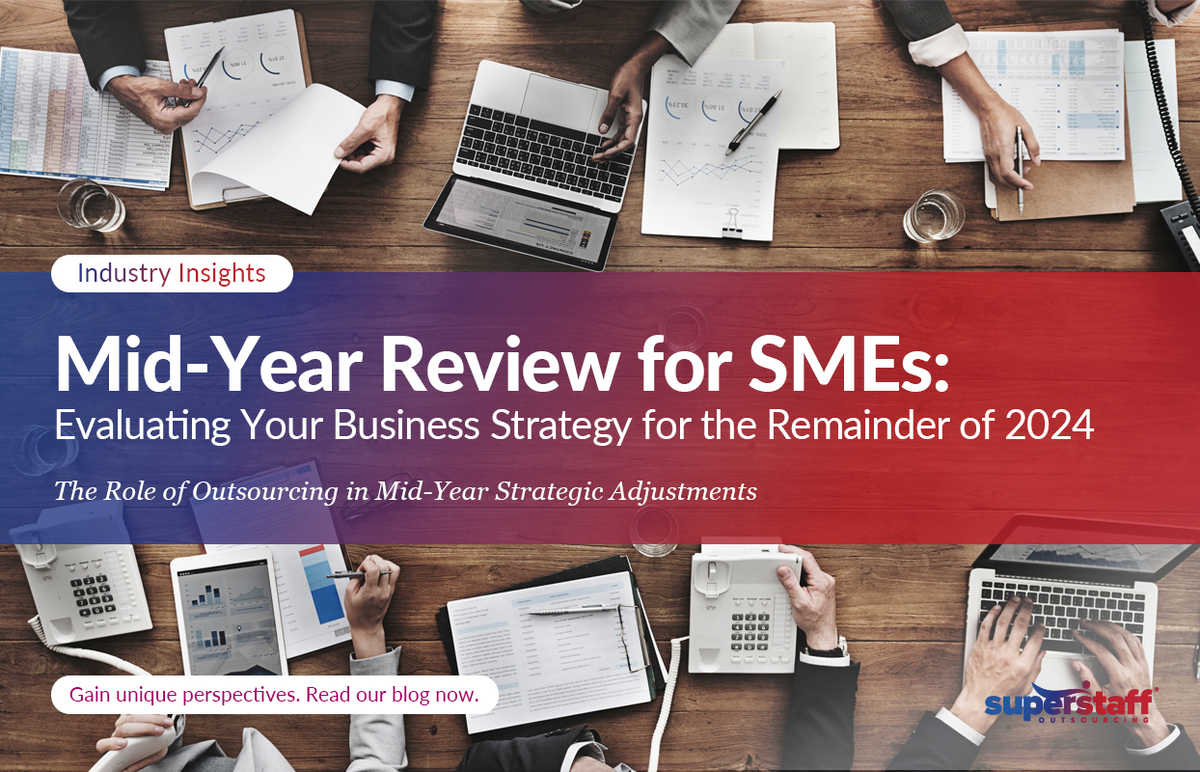 Mid-Year-Review-for-SMEs_Featured Different executives are in a meeting. Image caption reads: Evaluating Your Business Strategy for the Remainder of 2024