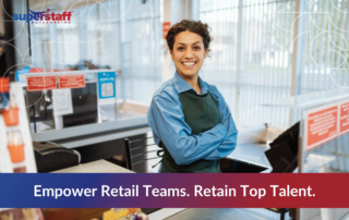 Smiling retail worker standing confidently behind a checkout counter, symbolizing the importance of empowering teams and boosting retail workforce retention in a competitive job market.
