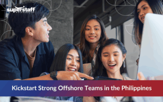 Smiling professionals during a training session, representing offshore team onboarding in the Philippines.
