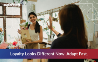 A smiling young woman receives flowers in a boutique, symbolizing emotional connection and customer appreciation—modern essentials of brand loyalty for Gen Z and Millennials.