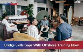Team in a modern office setting engaged in collaborative learning session, representing how companies use offshore training classes to bridge skills gaps and enhance workforce capabilities.