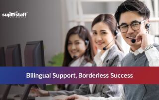 A diverse team of agents smiling while providing bilingual call center services at their desks.