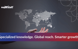 A hand reaching out towards a digitally outlined world map, symbolizing global expertise in outsourcing.