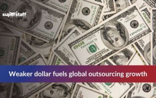 Dollars symbolizing financial aspects of global outsourcing trends.